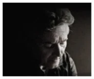 Thoughtful man in low light, capturing a moment of reflection