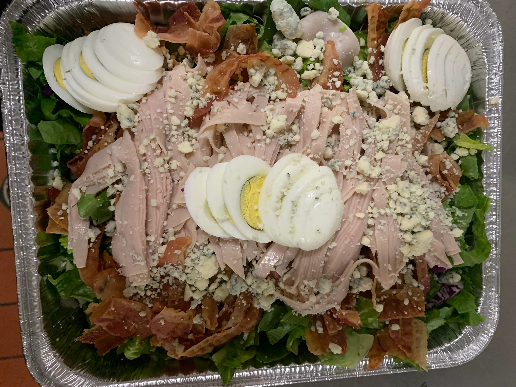 Cobb salad with turkey, bacon, and hard-boiled eggs