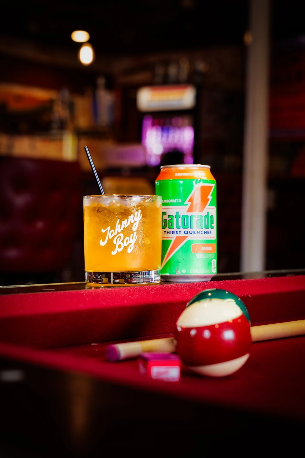 Cocktail and Gatorade on a bar table