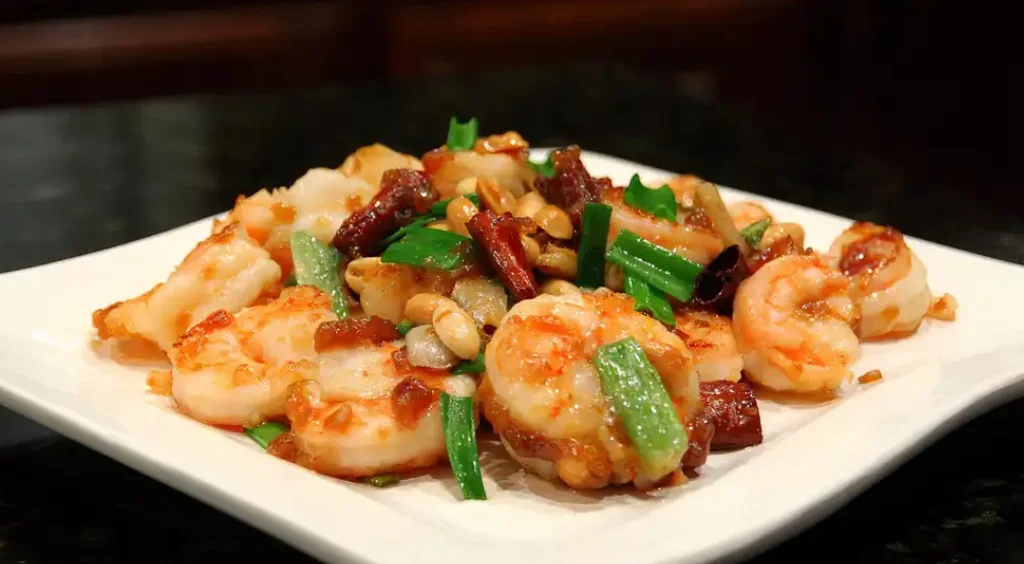 Sichuan-style shrimp stir-fry with peanuts and green onions