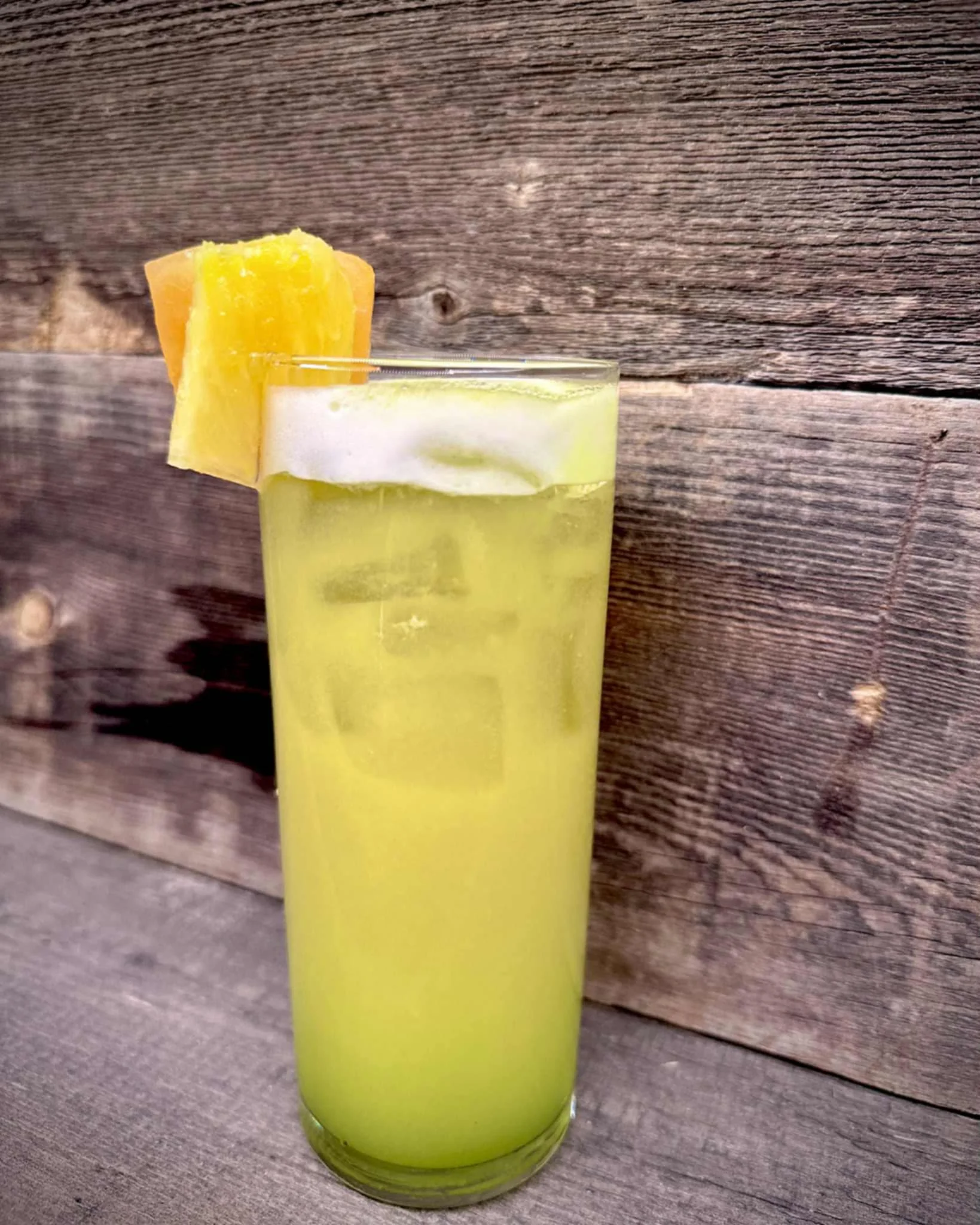 Refreshing tropical cocktail garnished with pineapple