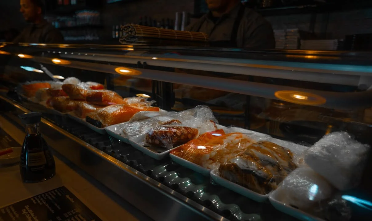 Assorted sushi and sashimi displayed in a restaurant