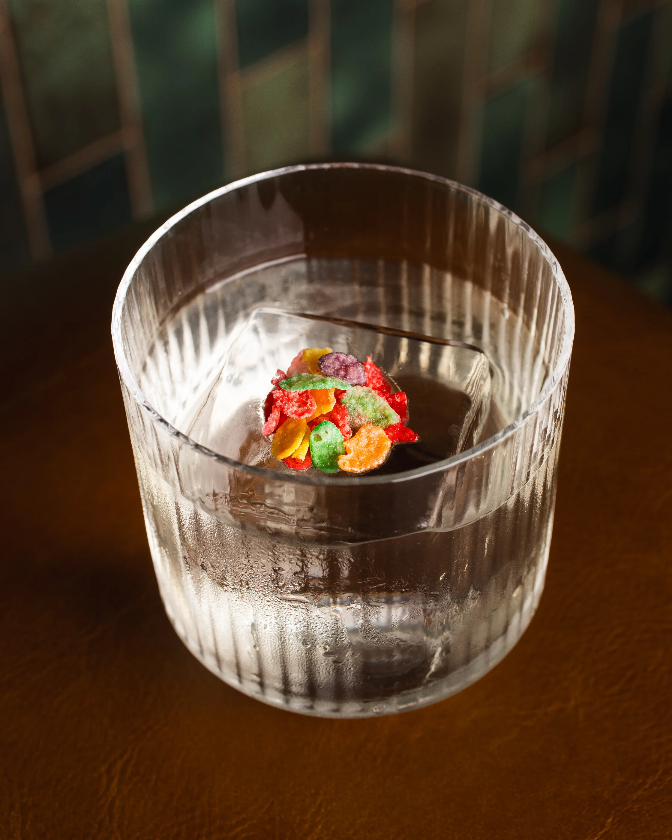 Elegant cocktail garnished with dried orange and flowers