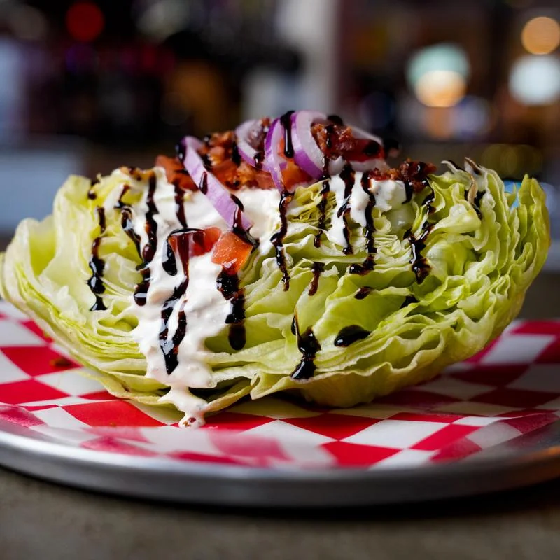 Wedge salad with creamy dressing and toppings