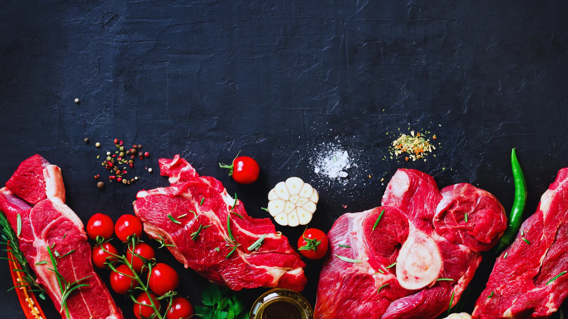 Fresh cuts of beef for grilling in a rustic kitchen