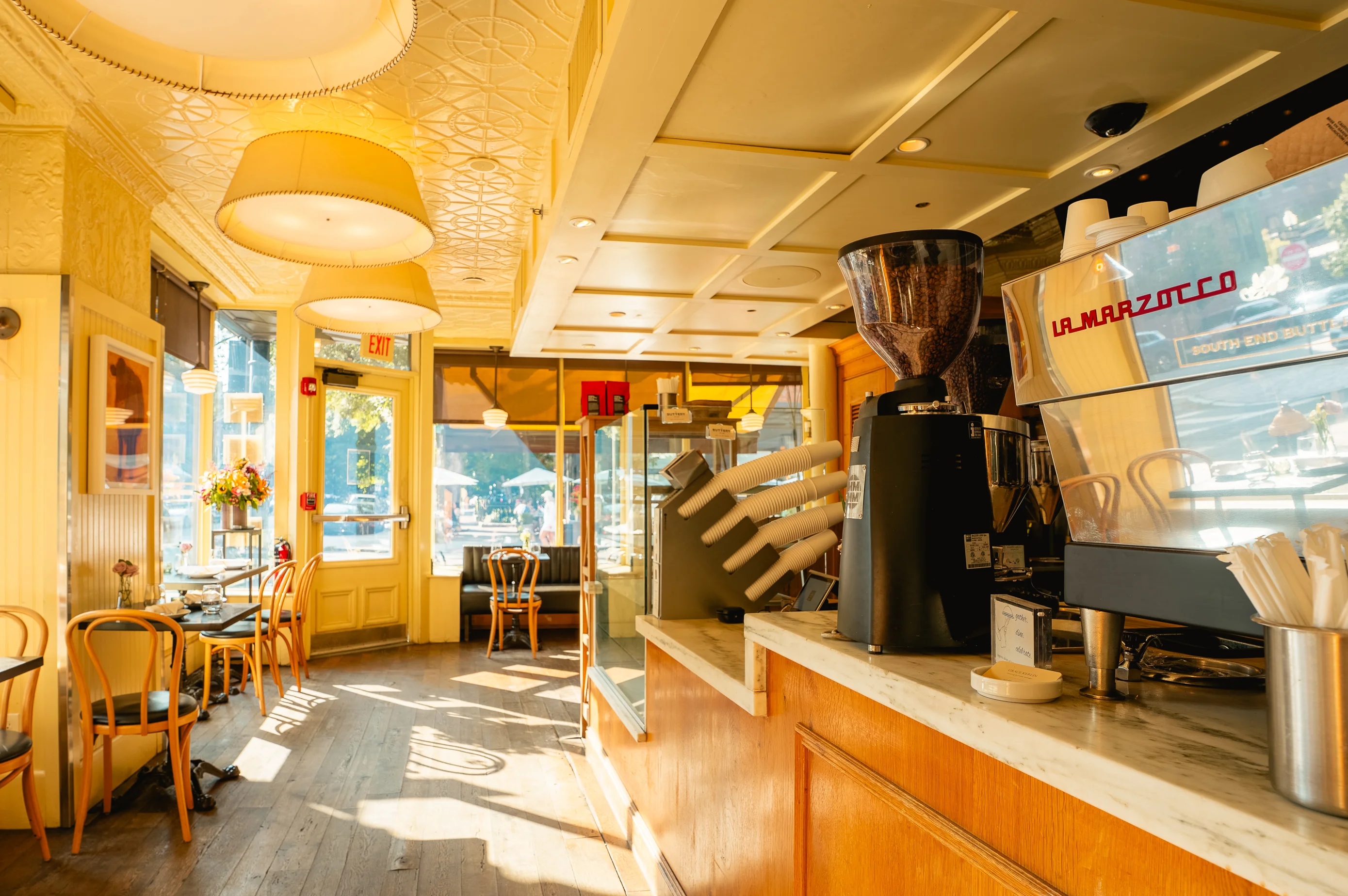 Bright and inviting restaurant interior with wooden accents and natural light