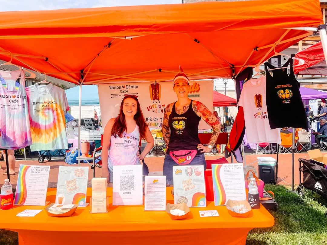 Vibrant food stall at a festival with colorful merchandise