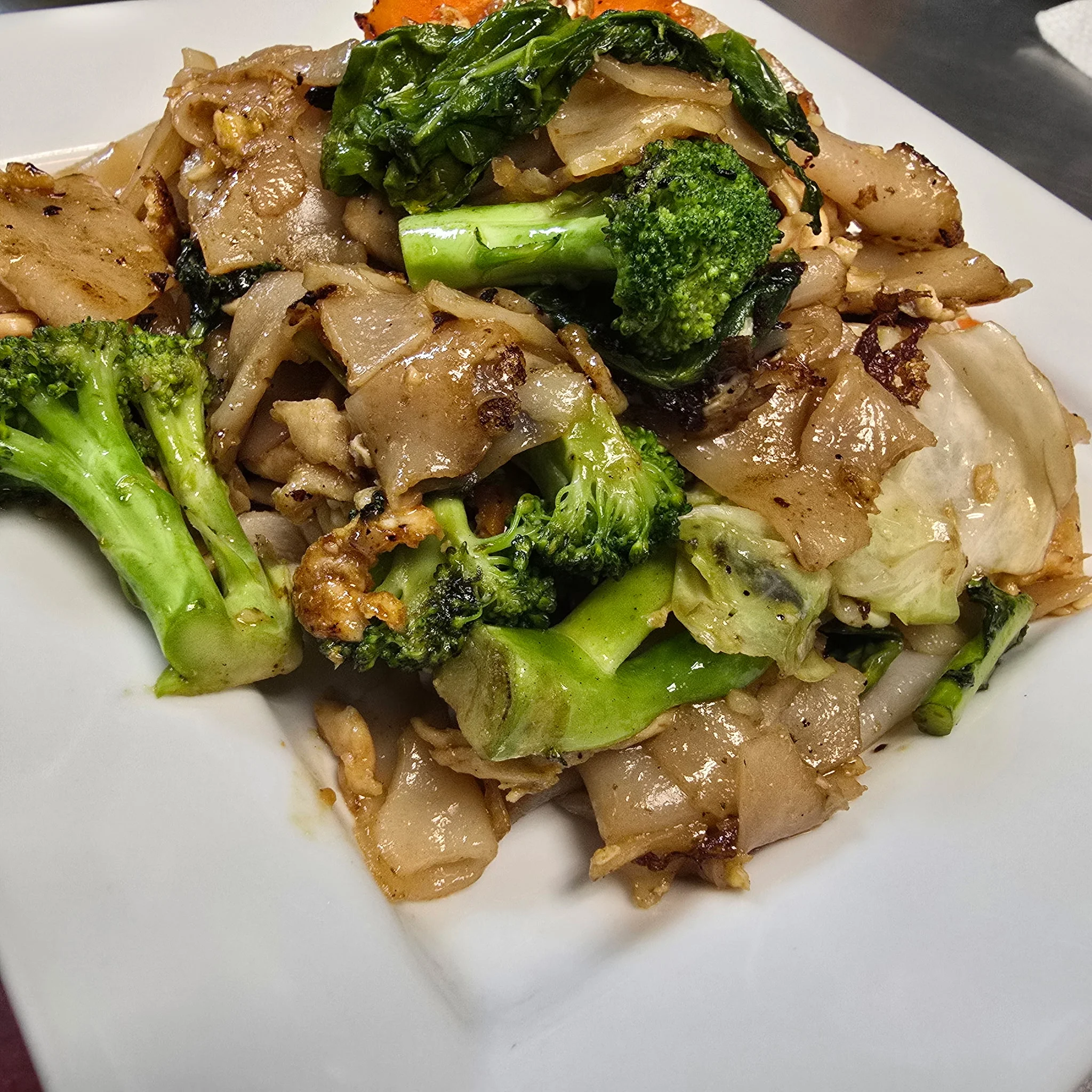 Stir-fried Thai pad see ew with broccoli and greens