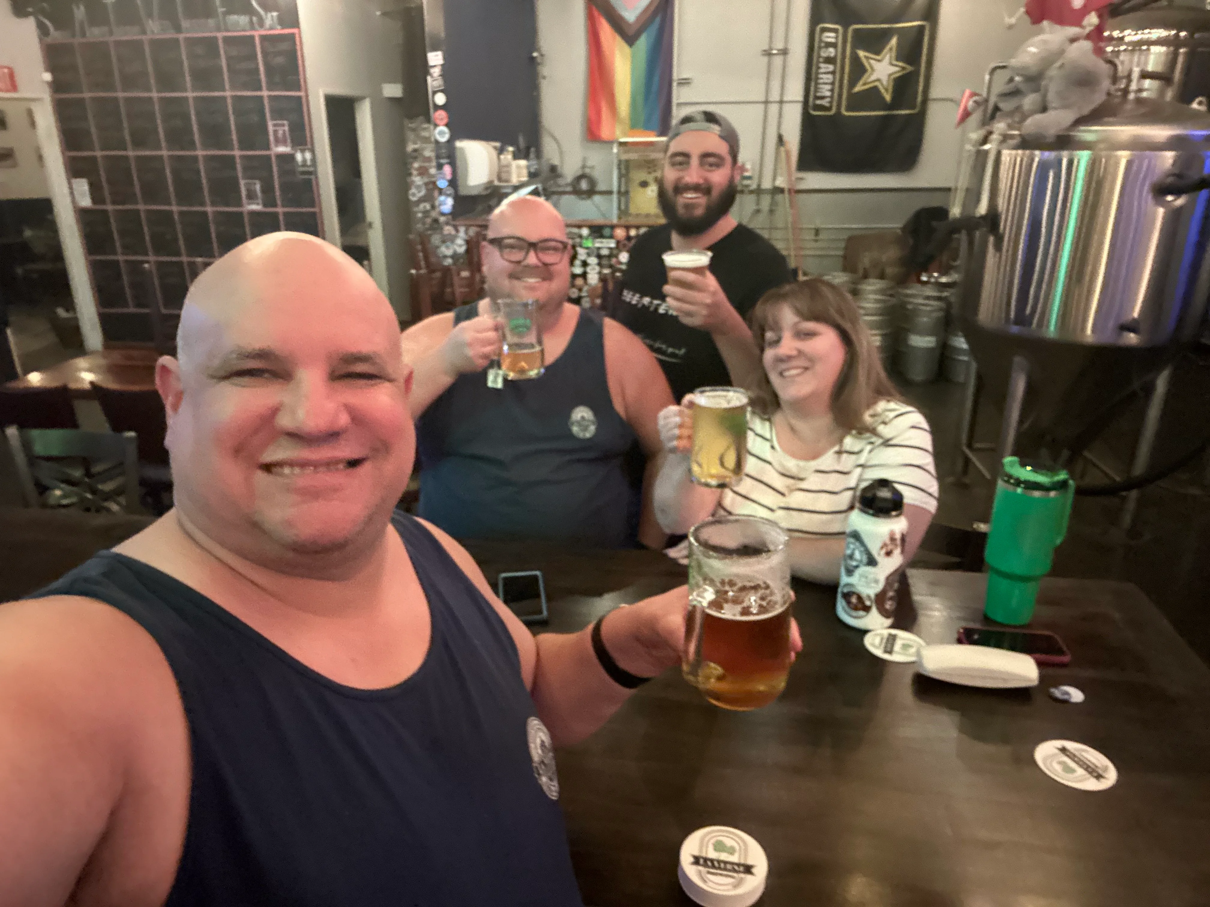 Group of friends enjoying craft beers at a lively bar