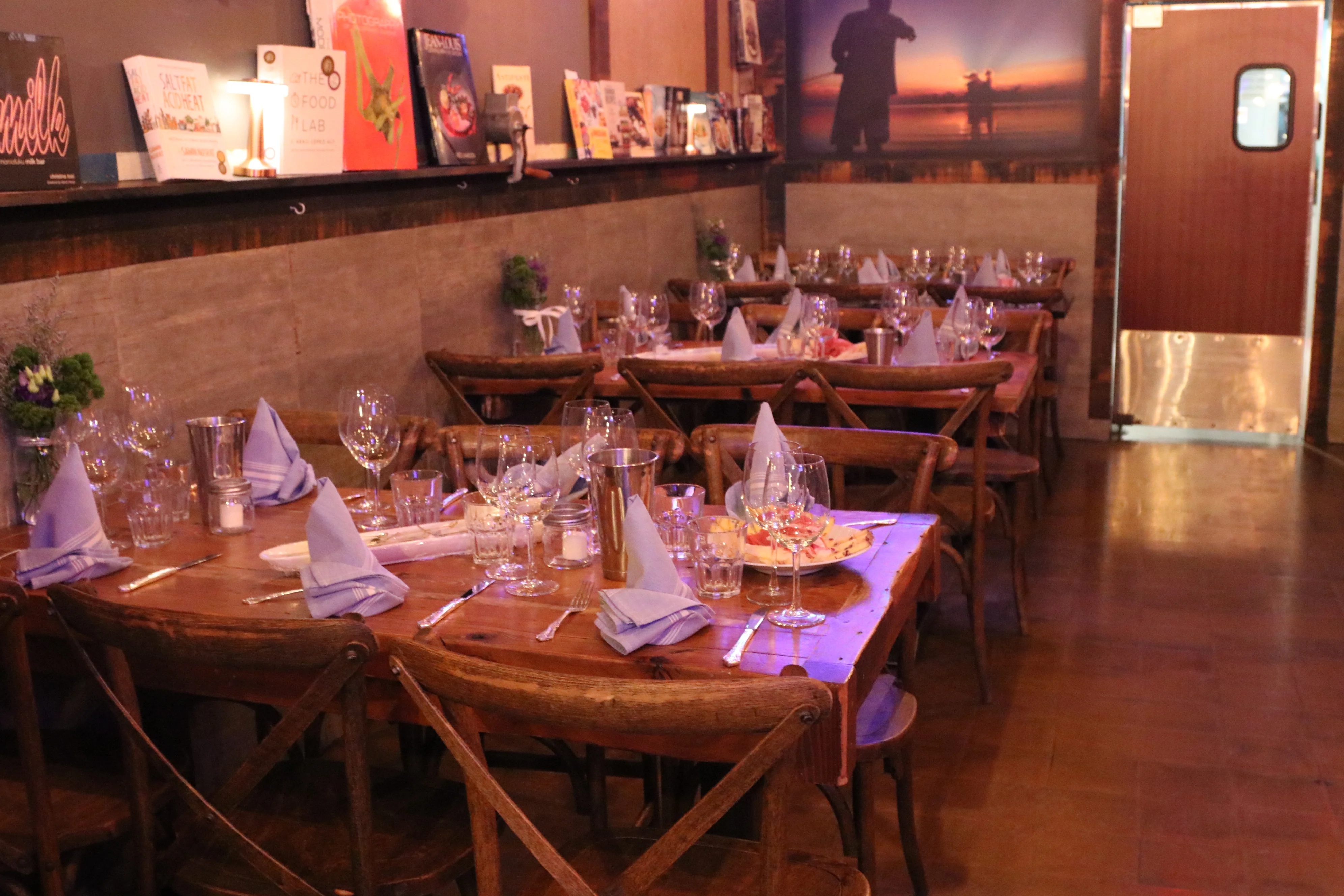 Cozy restaurant interior with wooden tables and elegant table settings
