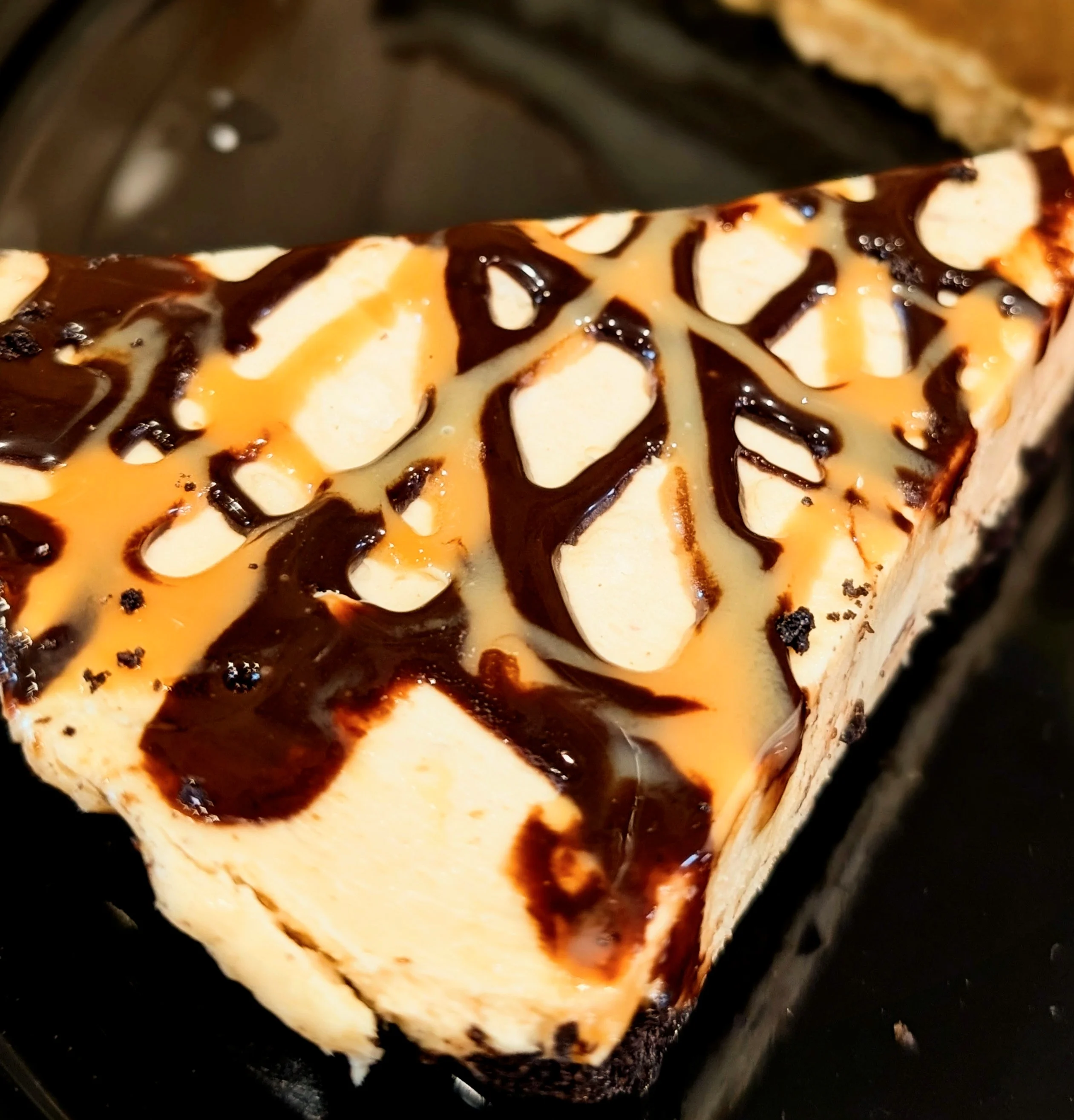 Decadent chocolate peanut butter cheesecake slice