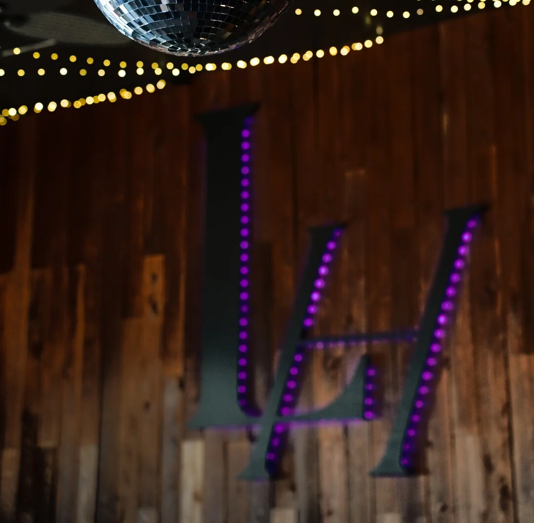 Disco ball reflecting lights in a stylish restaurant interior