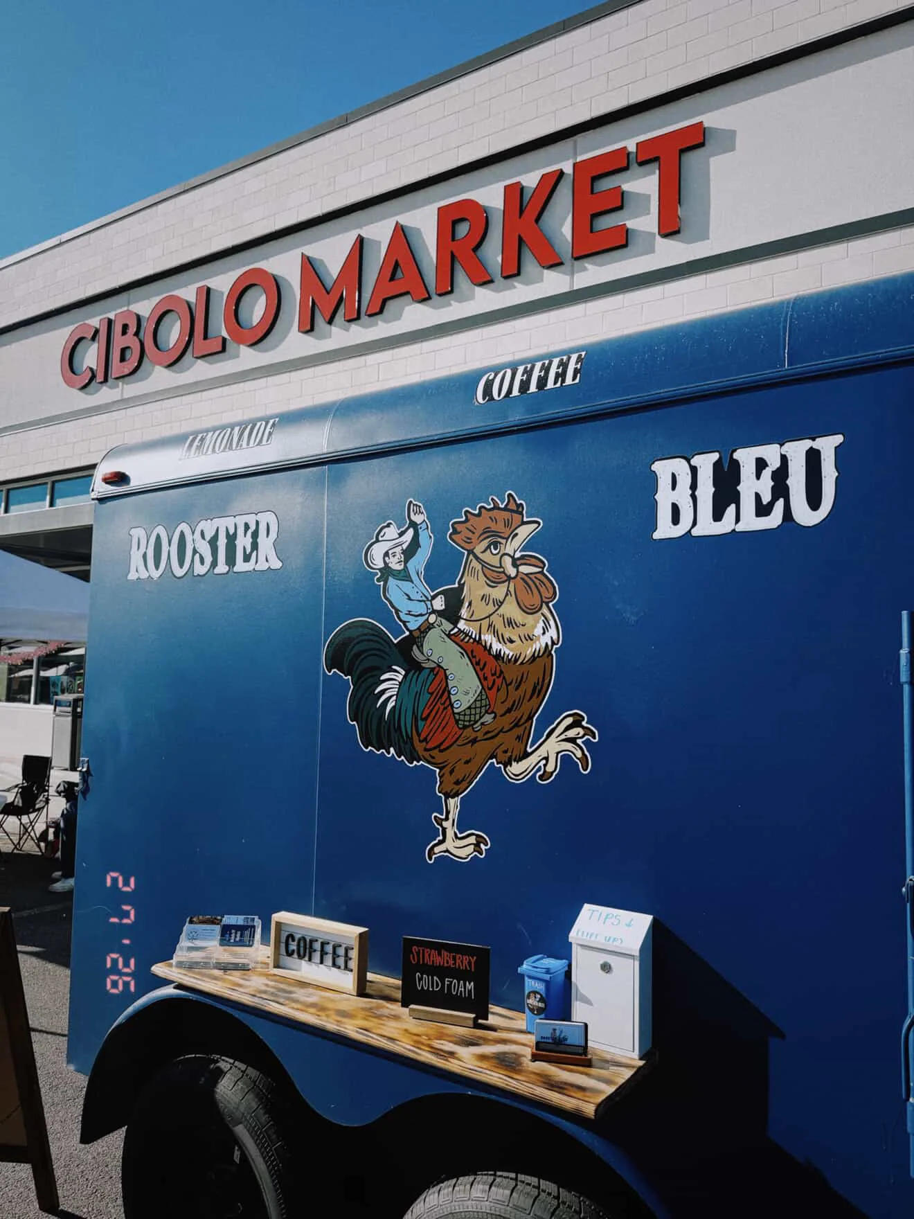 Coffee trailer at Cibolo Market with vibrant rooster design