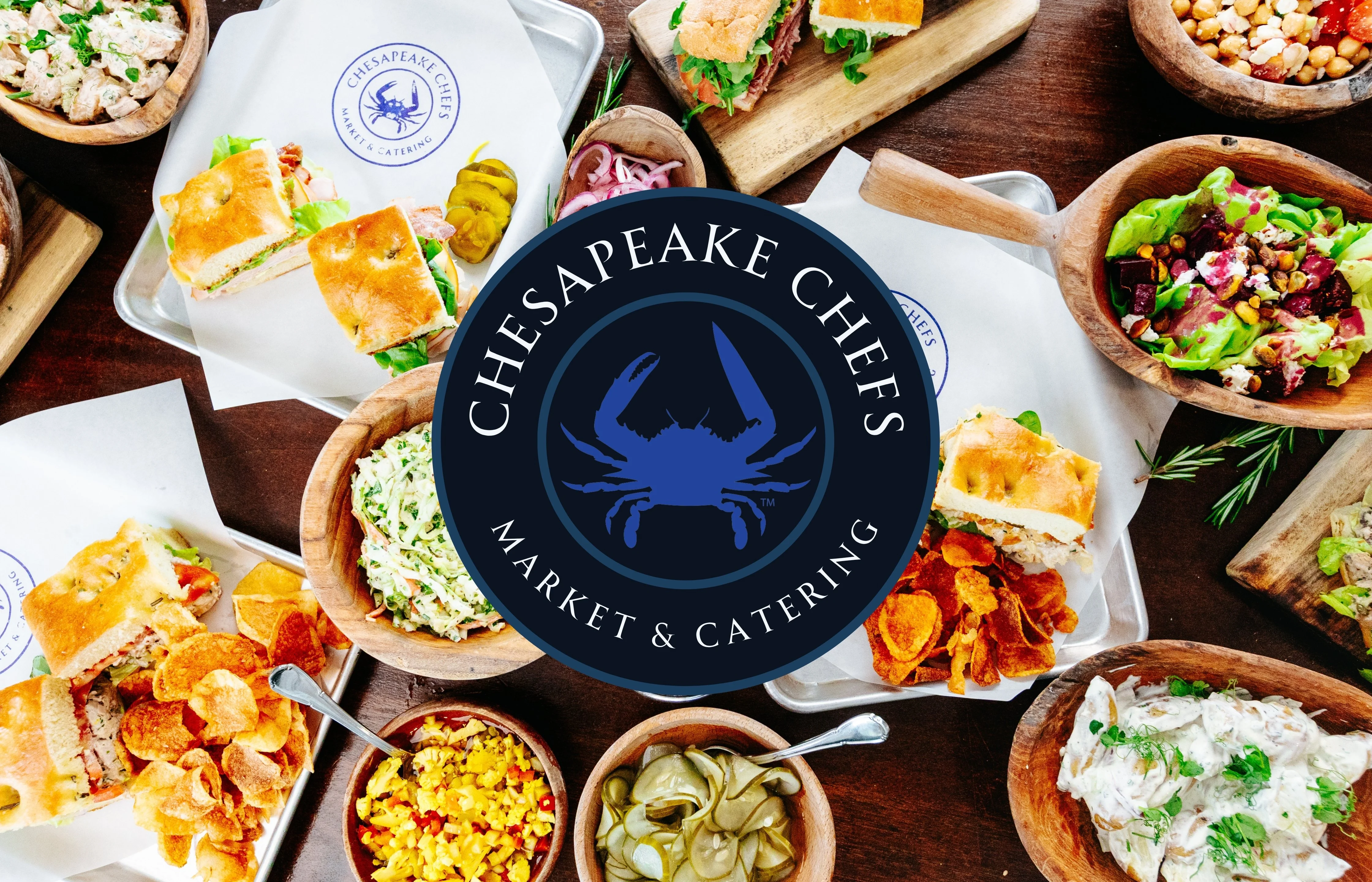 Assorted Chesapeake seafood dishes and sandwiches on a wooden table