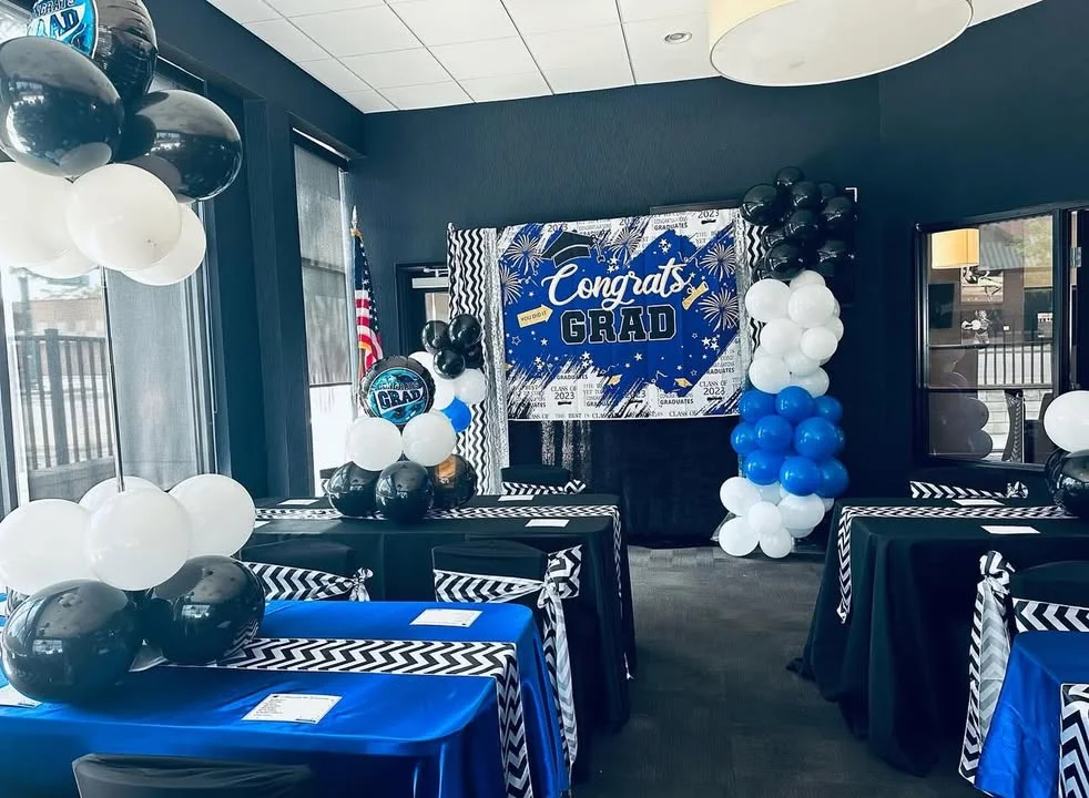 Festive graduation party decor with balloons and banners