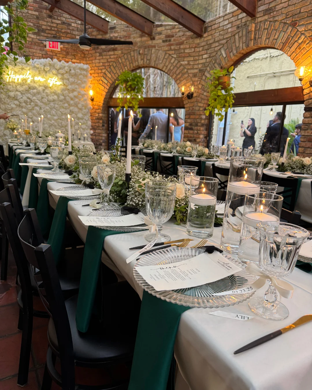 Elegant dining setup with candles and floral decor