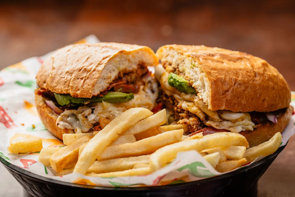 Delicious torta sandwich with fries, a Mexican classic