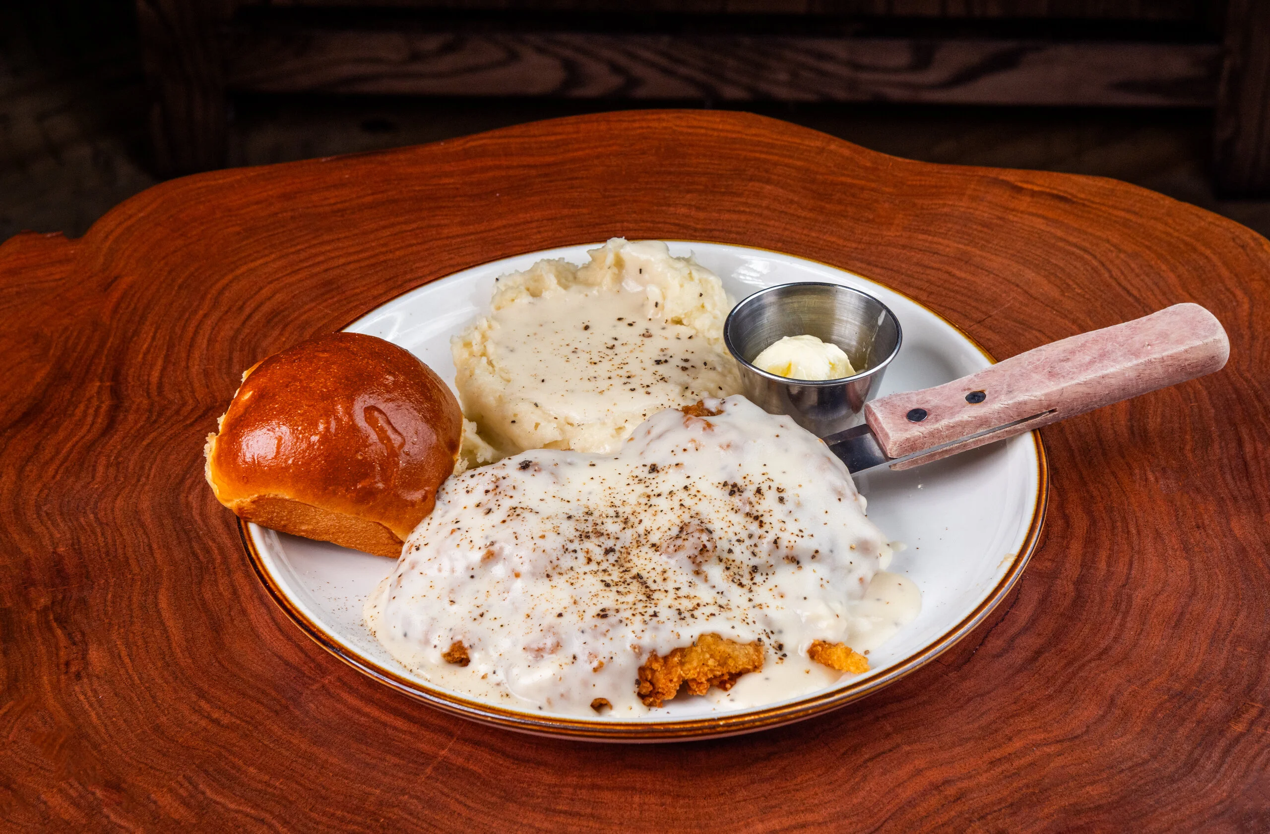 Southern chicken fried steak with gravy and mashed potatoes