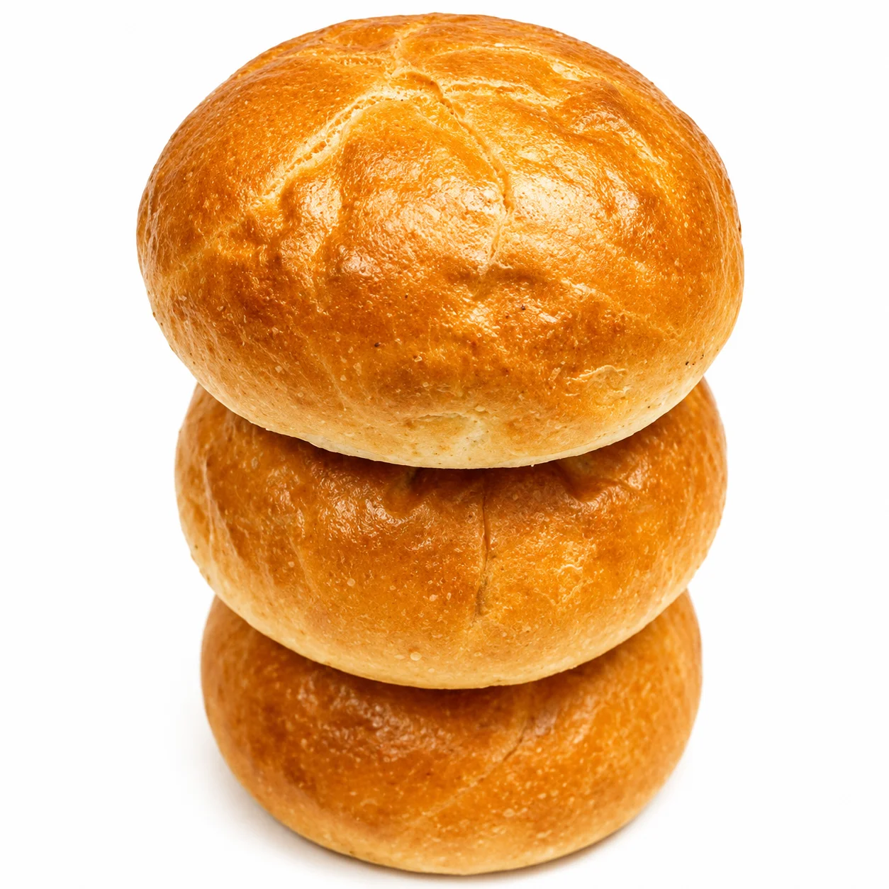 Three freshly baked round bread rolls stacked on top of each other.