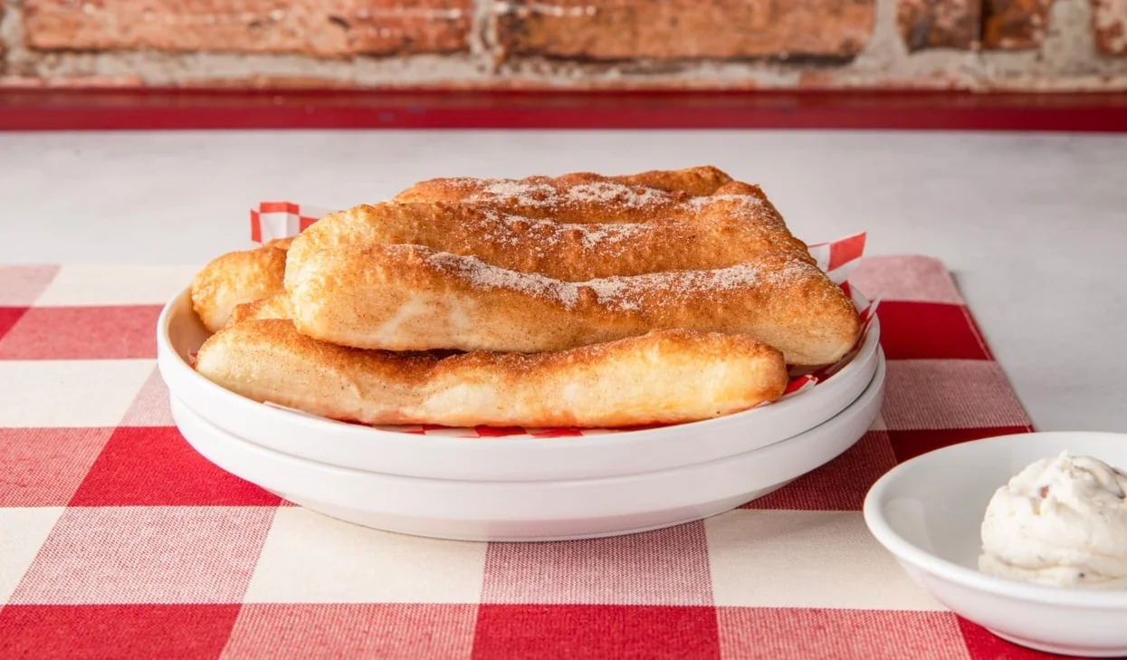 Cinnamon sugar churros served with creamy dip