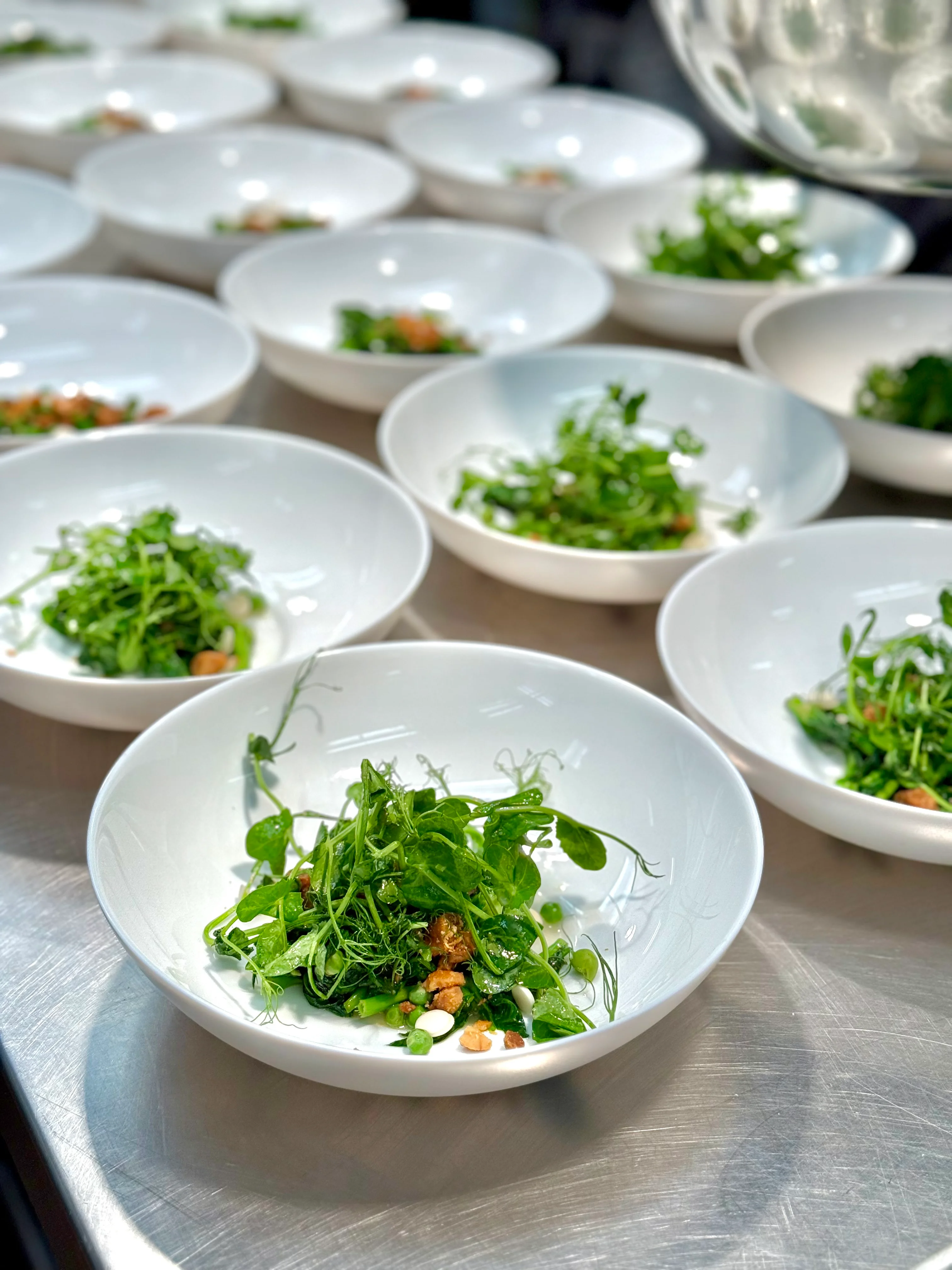 Fresh garden salad in elegant white bowls