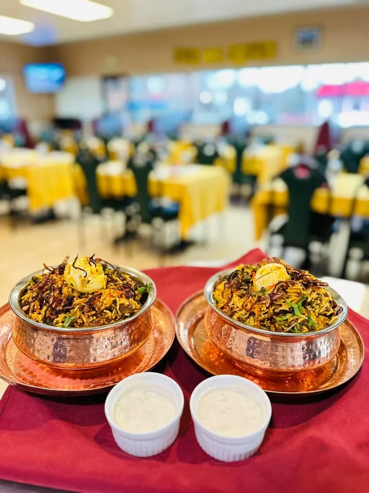 Authentic Indian biryani served in traditional copper bowls