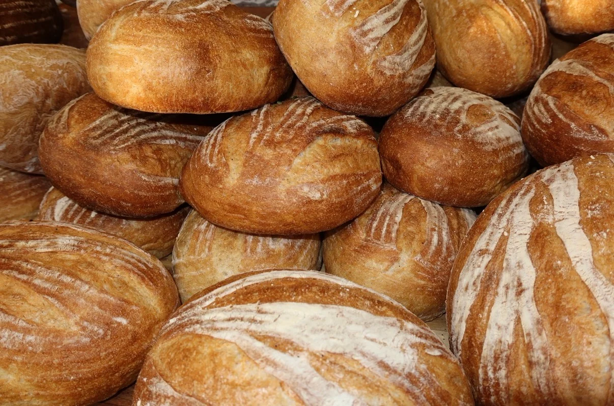 Freshly baked artisan bread rolls stacked