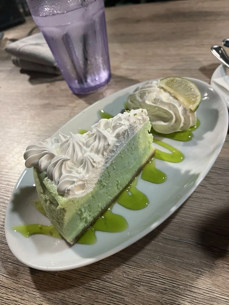 Refreshing key lime cheesecake with whipped cream