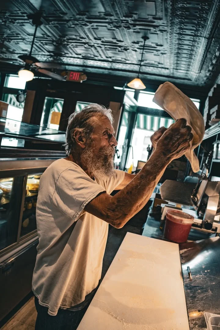 Original owner Al DeFosche throwing dough