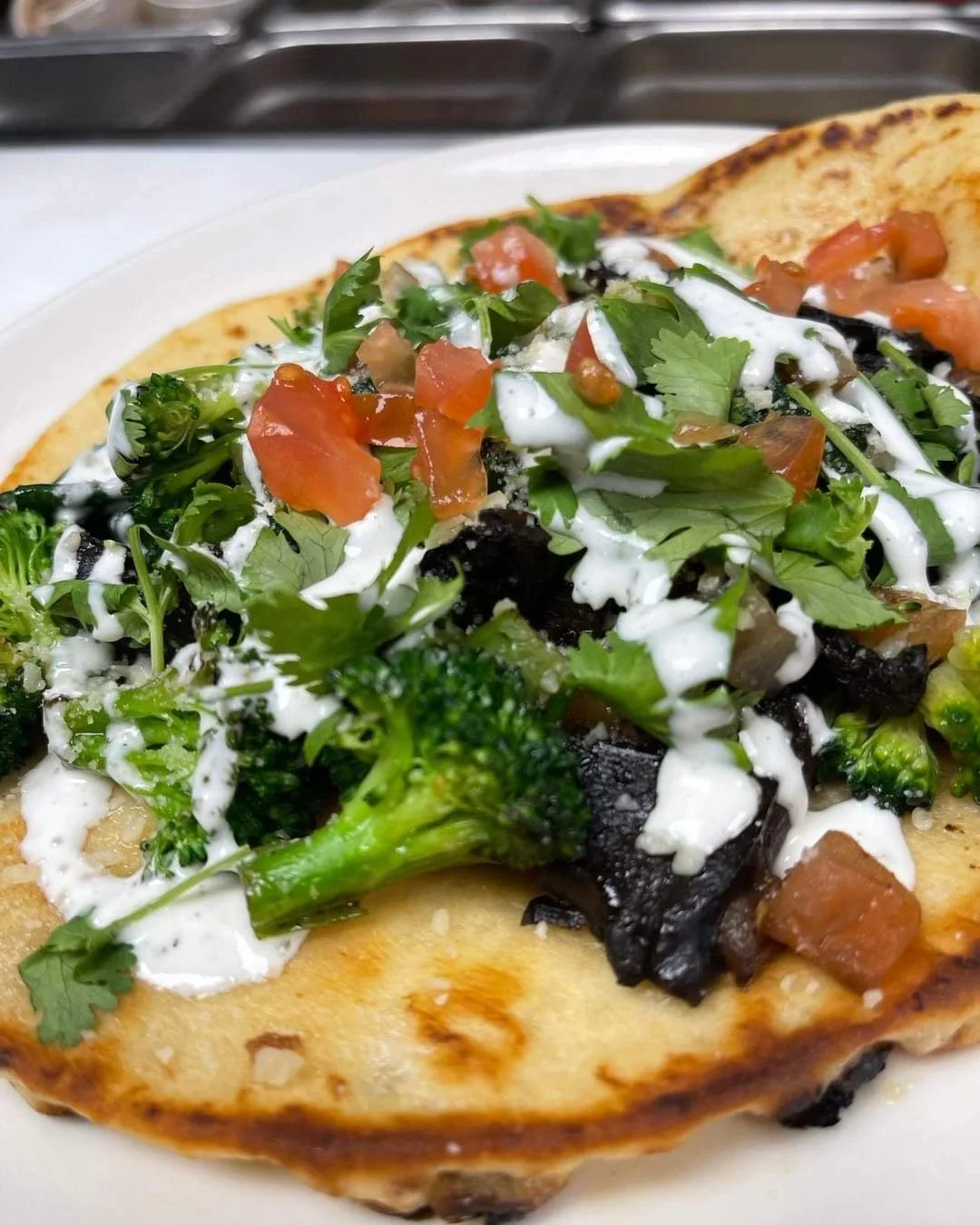 Vegetarian taco with broccoli and fresh toppings