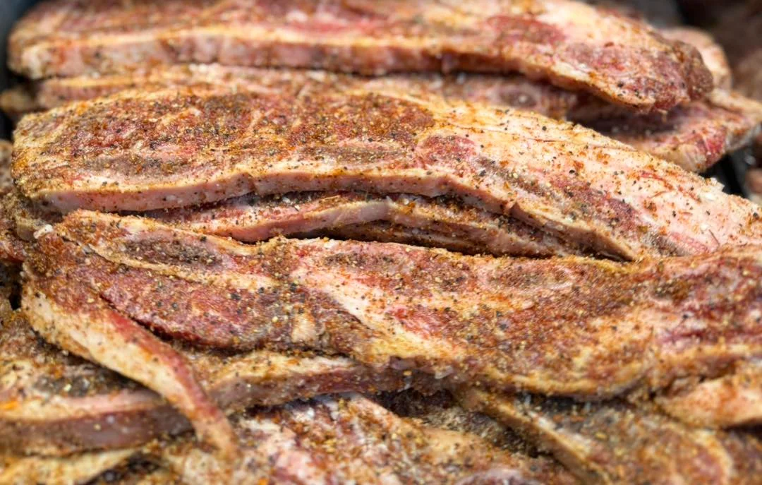 Seasoned beef brisket ready for grilling