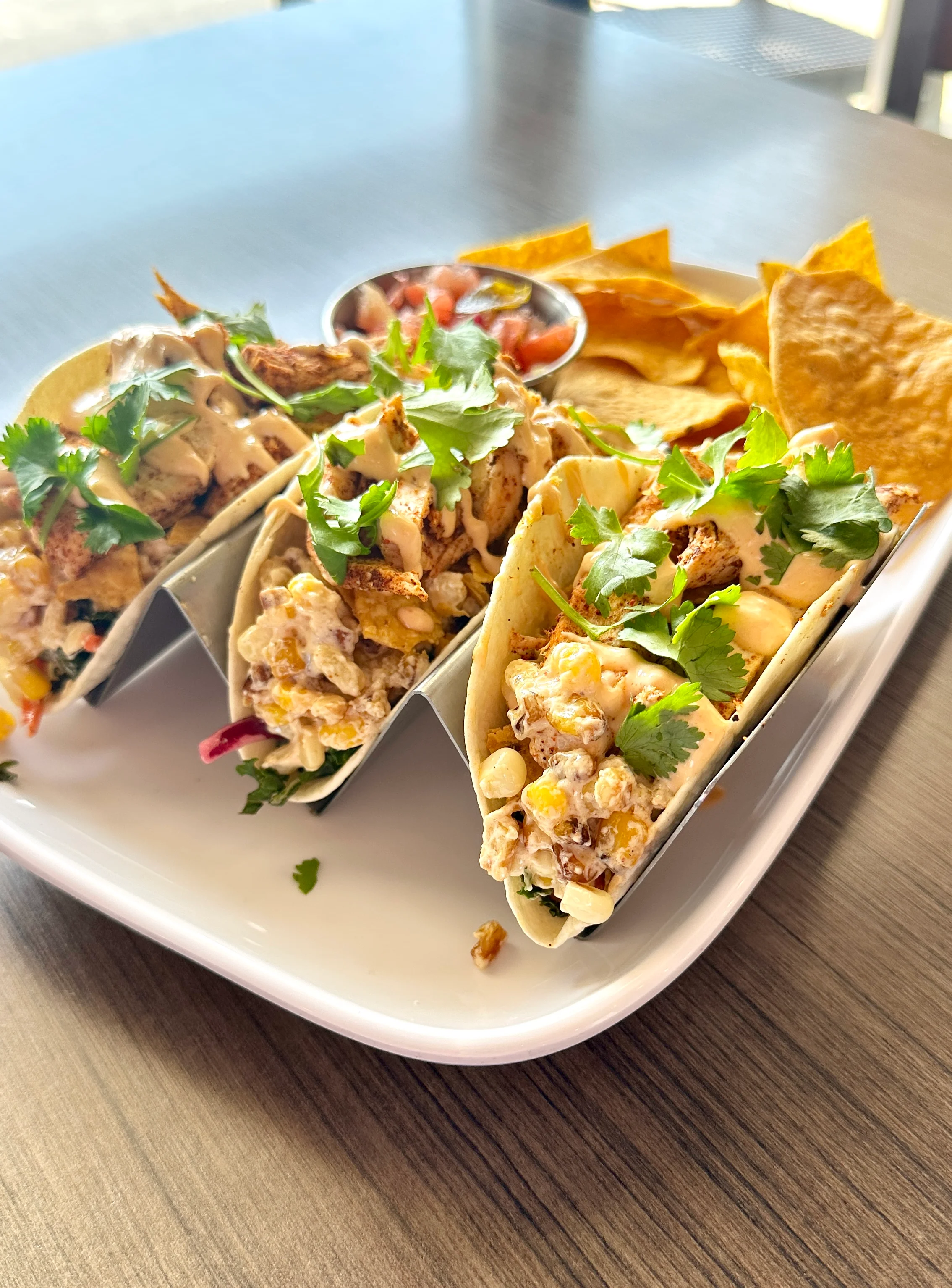 Delicious chicken tacos with cilantro and sauce