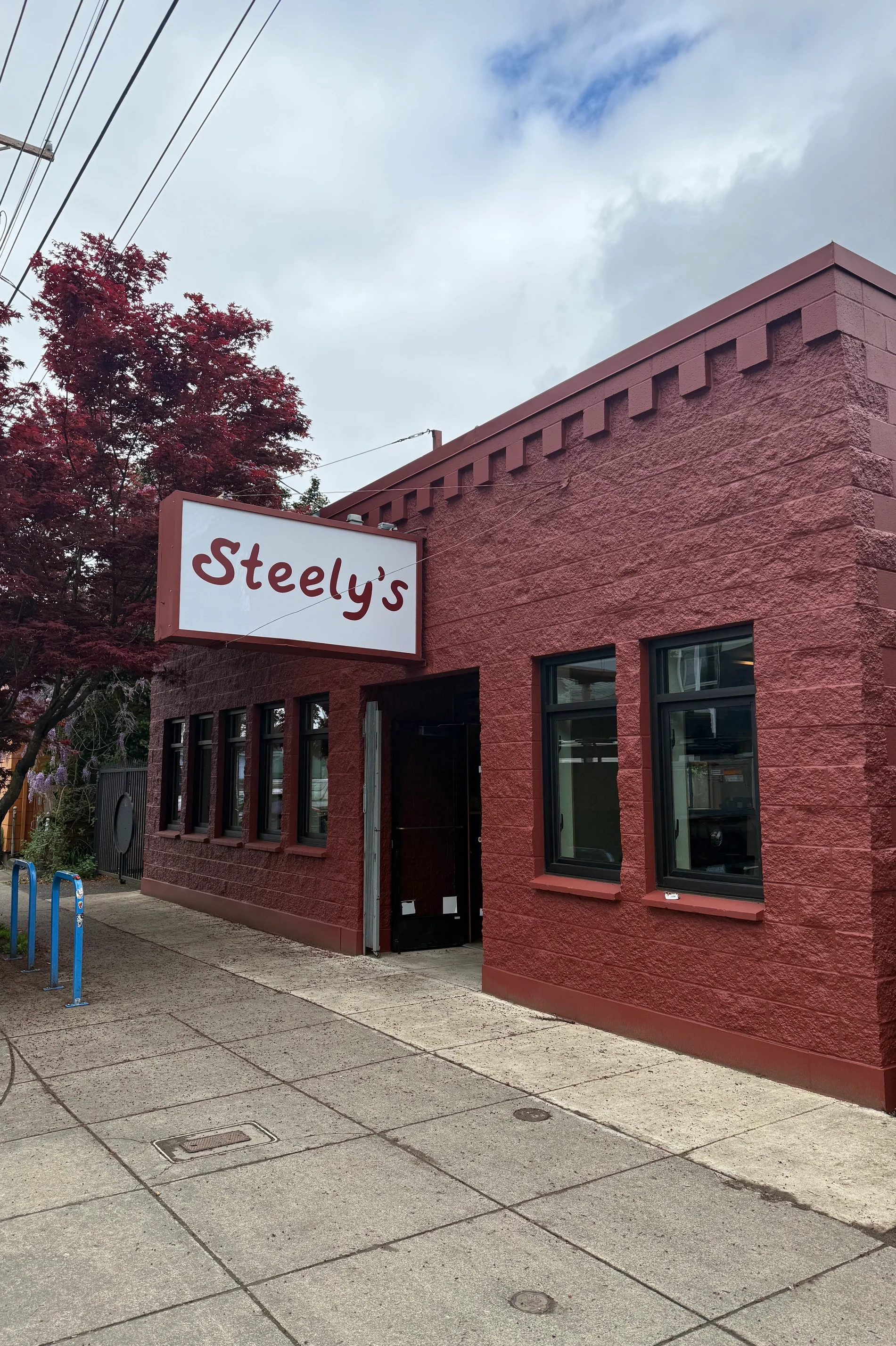 Exterior view of Steely's restaurant with red brick facade and signage.