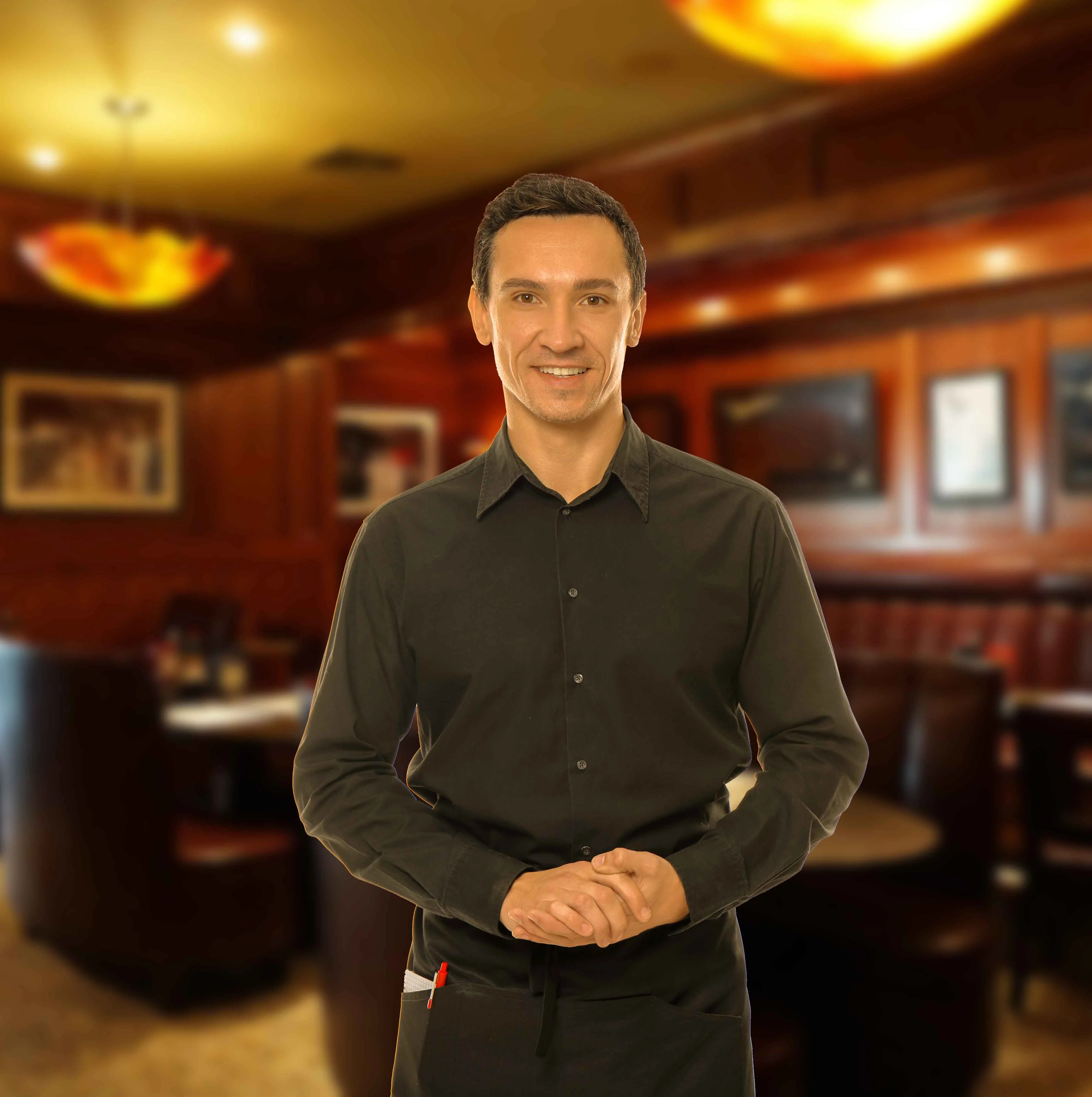 Friendly waiter in a cozy restaurant setting