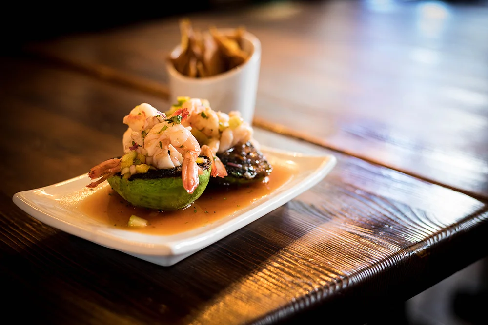 Grilled shrimp ceviche served in avocado half