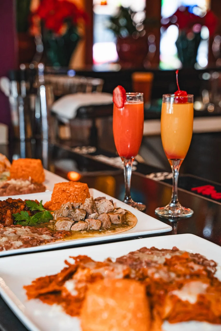 Colorful Mexican platter with tacos and cocktails