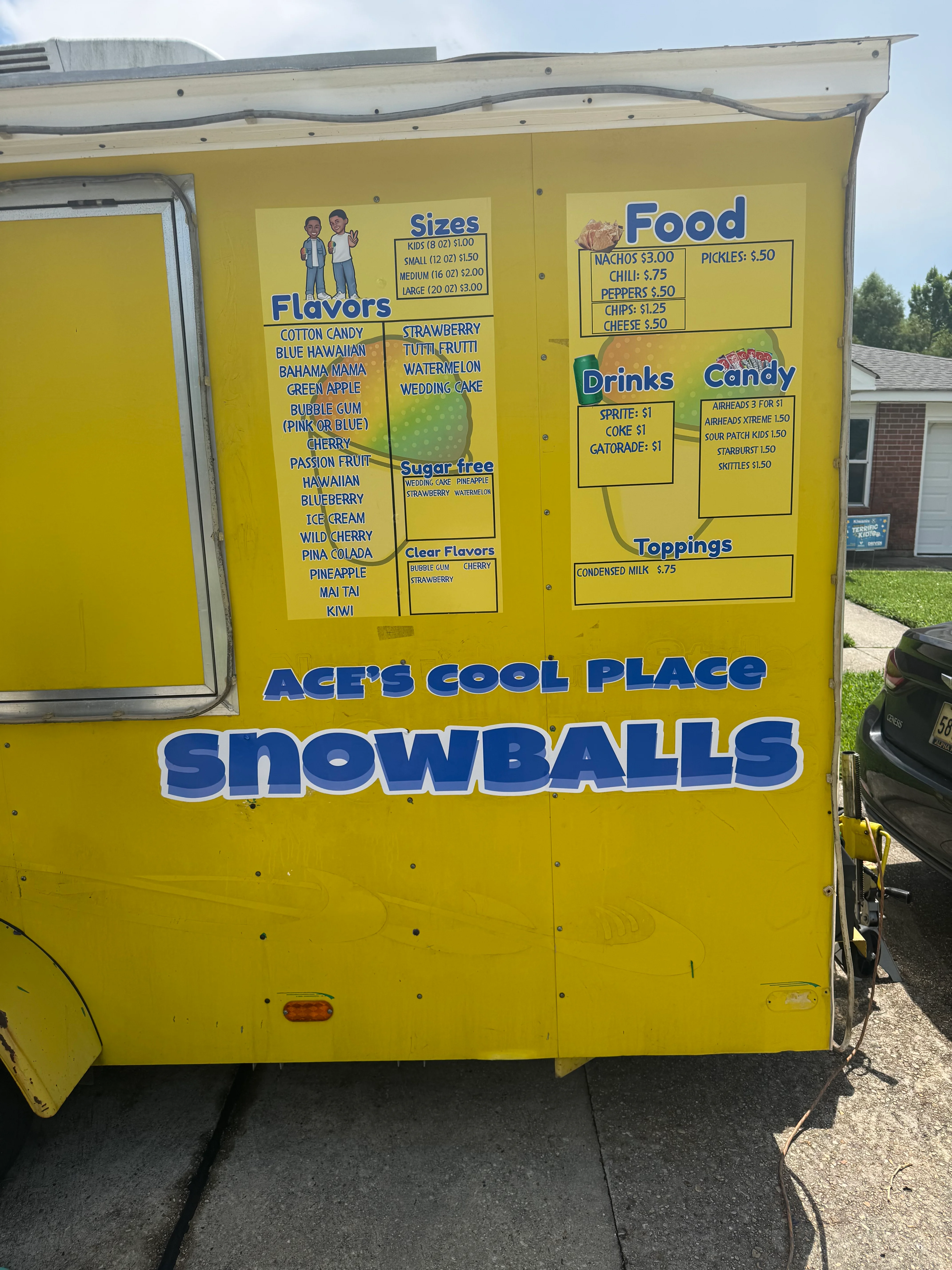 Colorful snowball stand offering various flavors and snacks