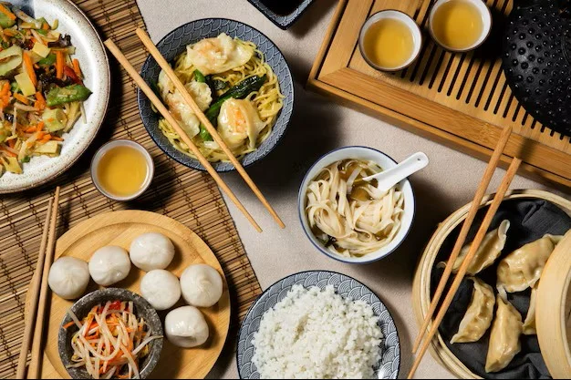 Assorted Chinese dim sum with noodles and tea