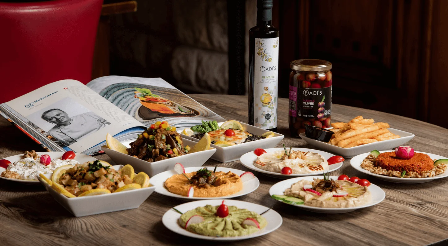Assorted Middle Eastern dishes including kebabs and hummus