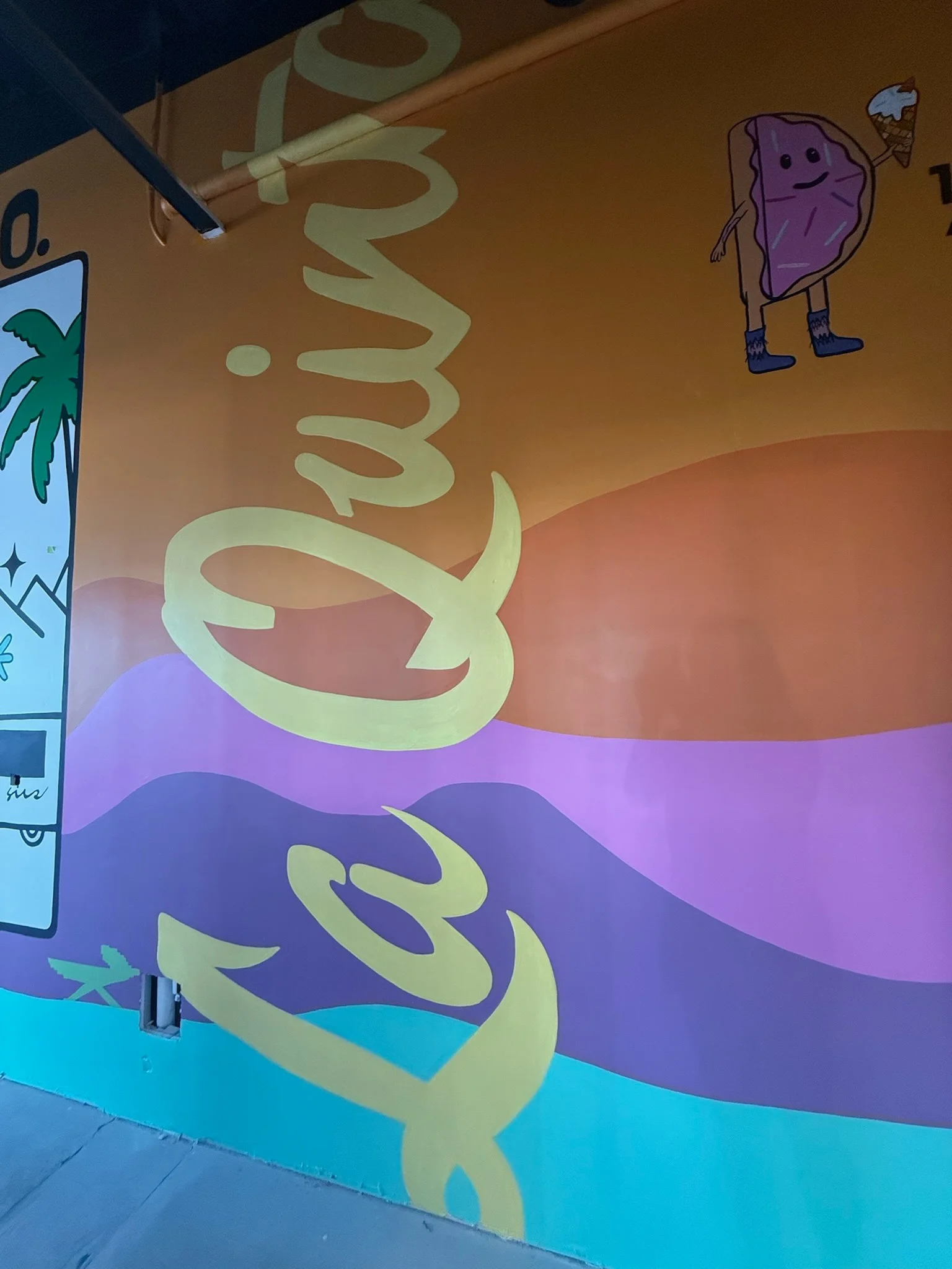 Colorful mural featuring La Quinta branding and playful character