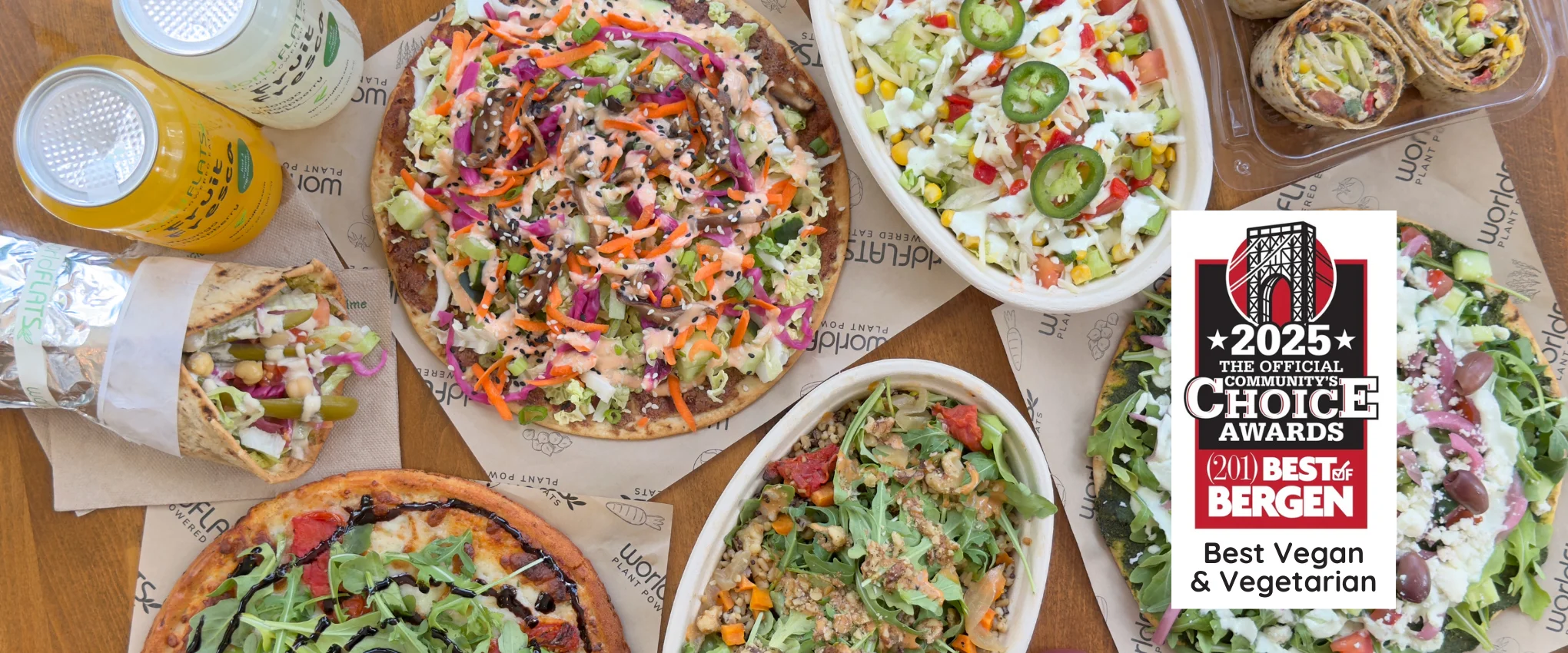 Table spread of flatbreads, bowls, burgers, and more