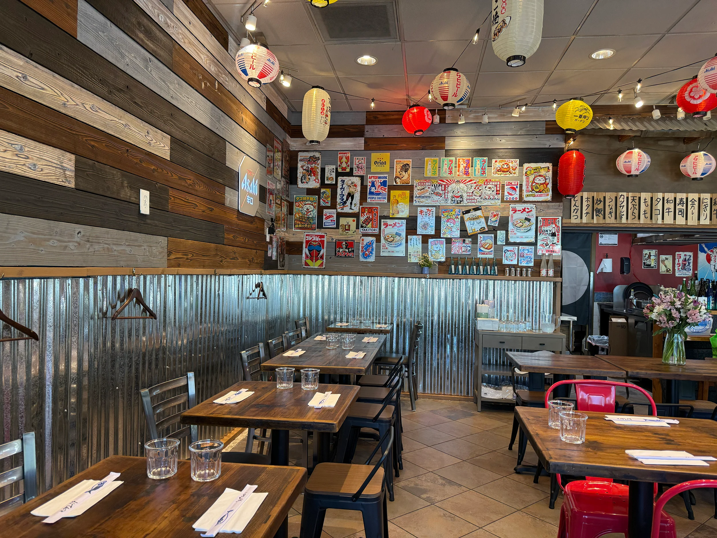 Cozy restaurant interior with wooden walls and colorful lanterns