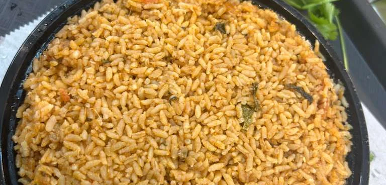 Spicy Indian biryani served in a black bowl
