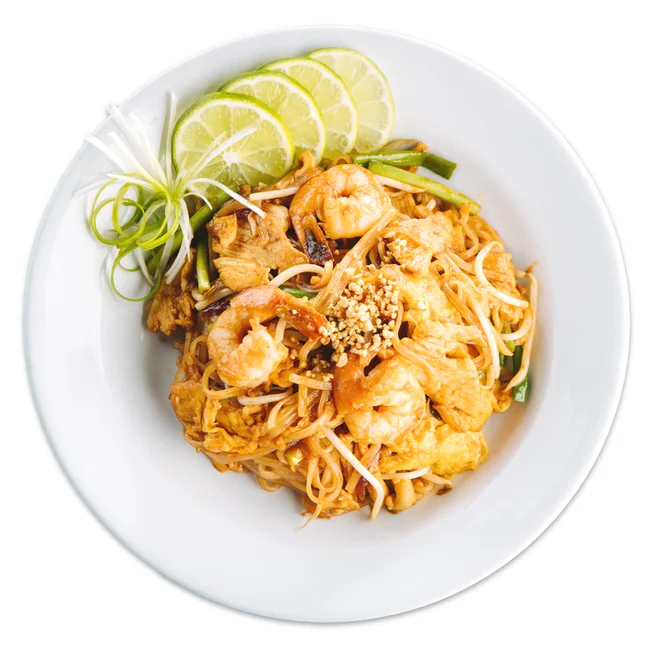 Delicious Thai pad thai with shrimp and lime wedges