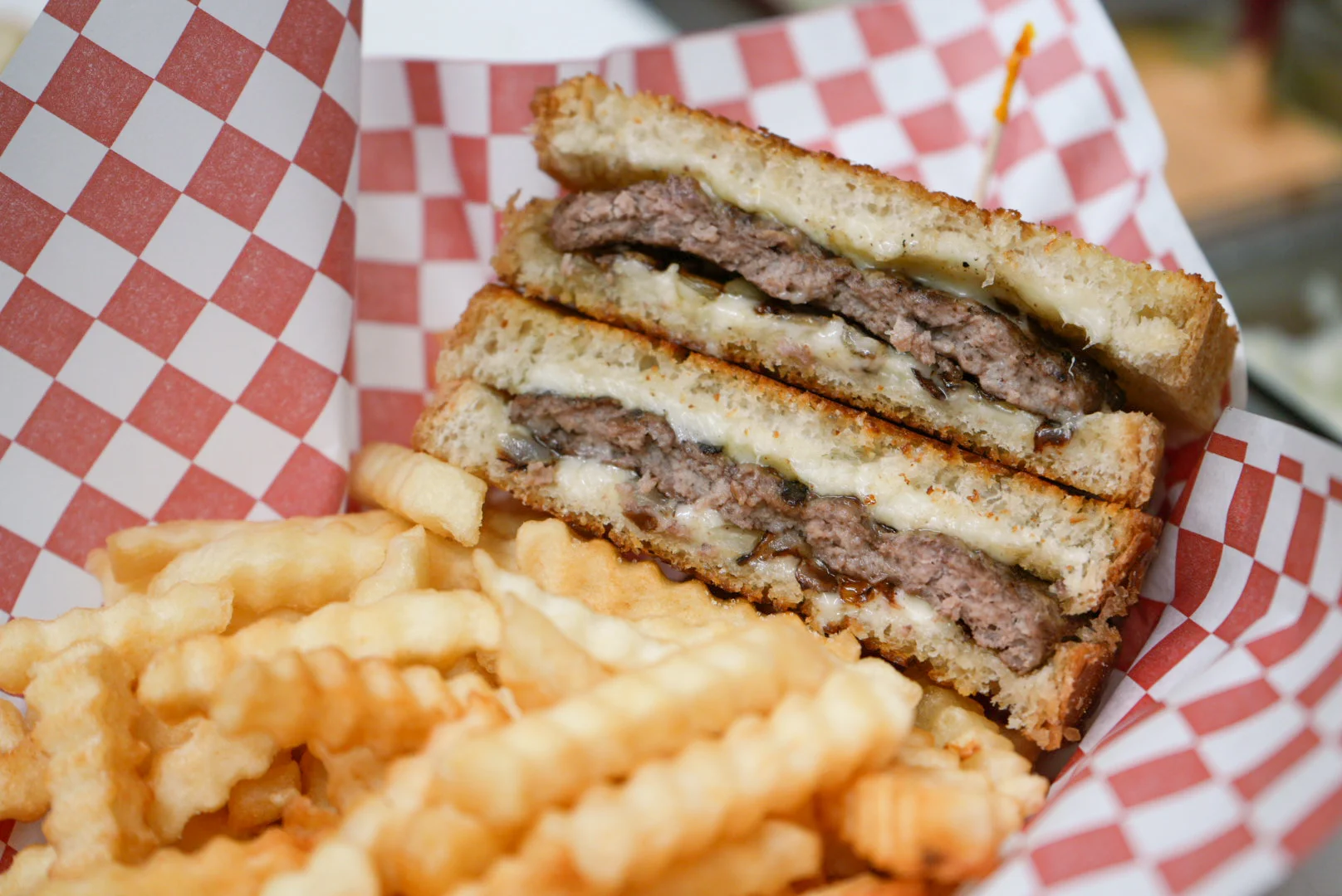 Classic American cheeseburger sandwich with fries