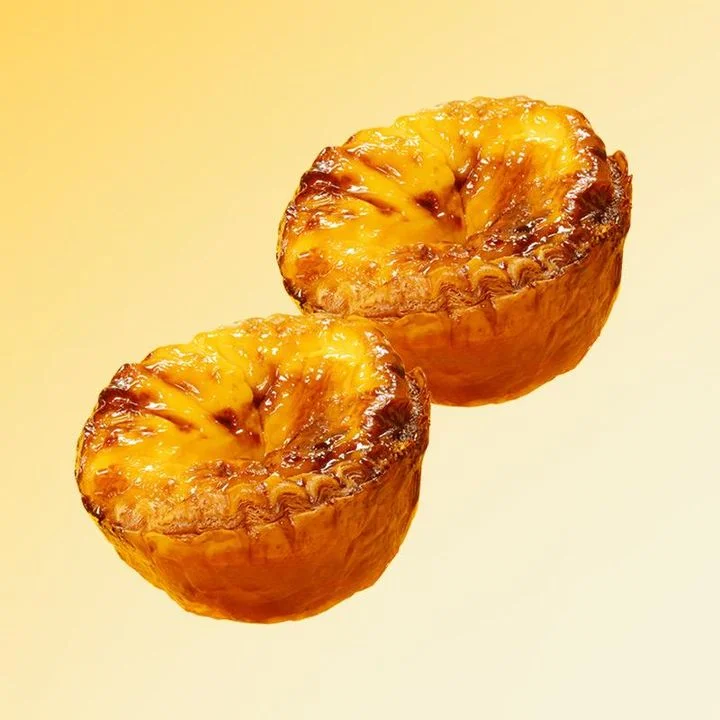 Delicious Portuguese pastéis de nata on a golden background