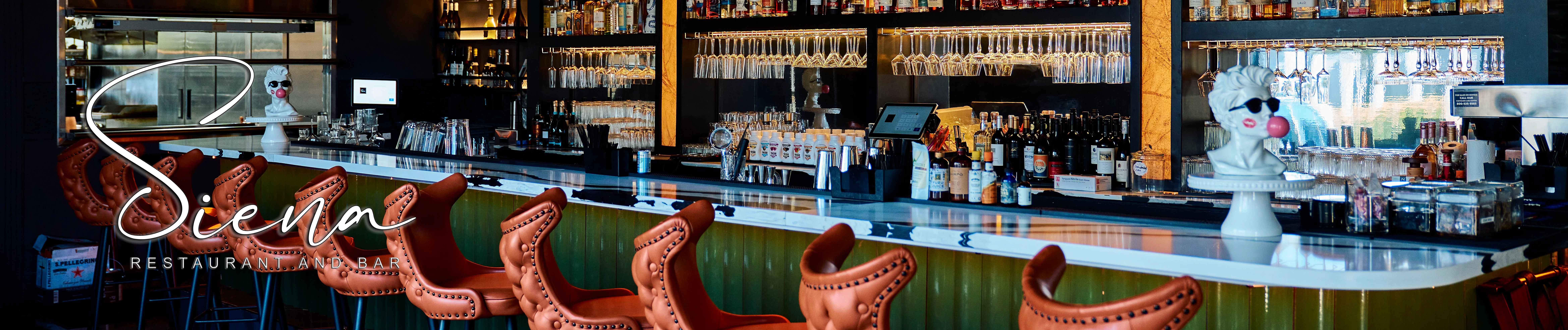 Stylish bar interior with modern seating and a well-stocked liquor display