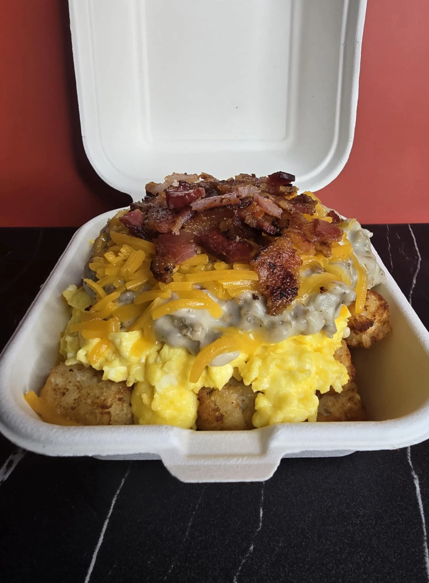 Loaded breakfast tater tots with bacon and cheese