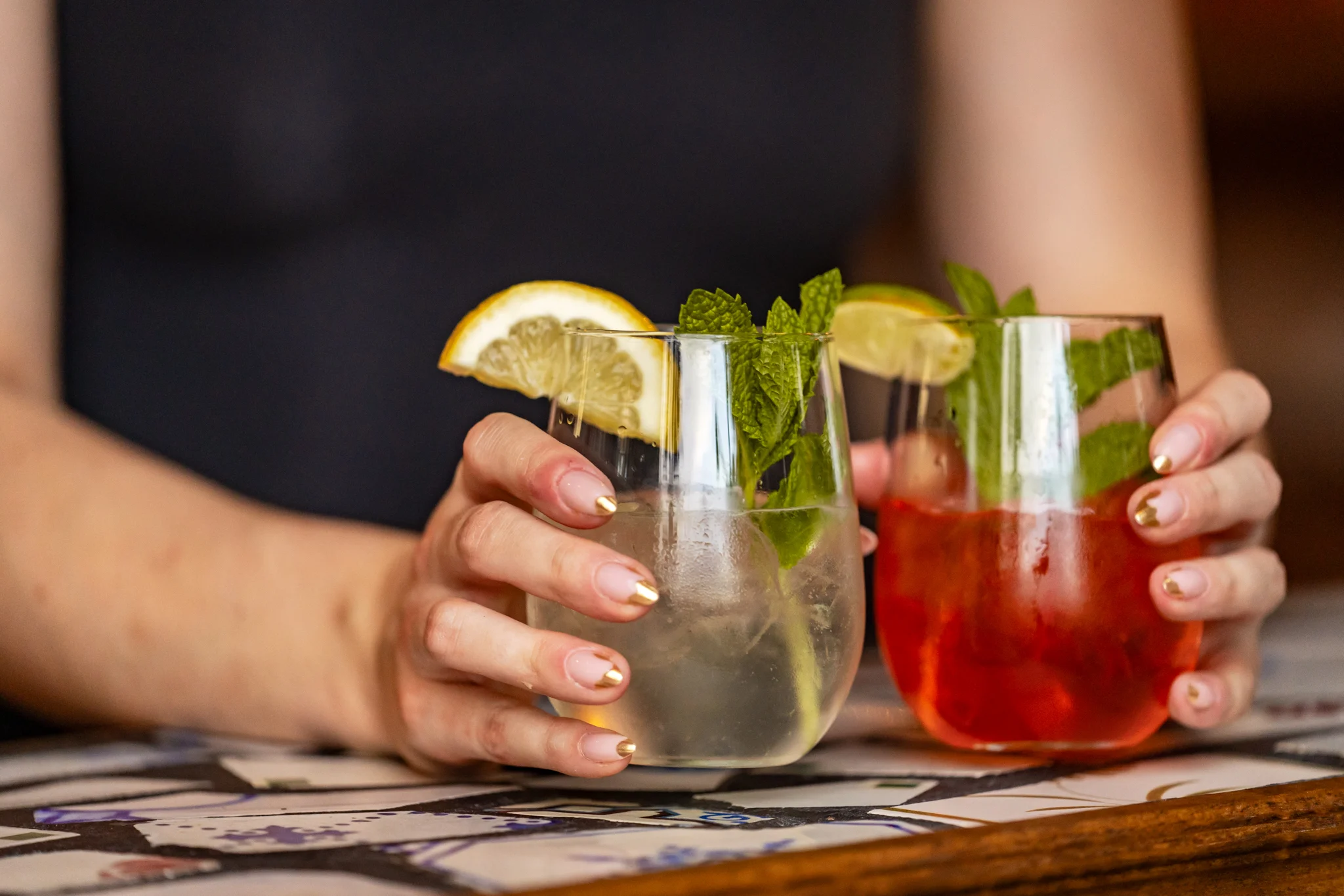 Refreshing cocktails with mint and lemon garnishes