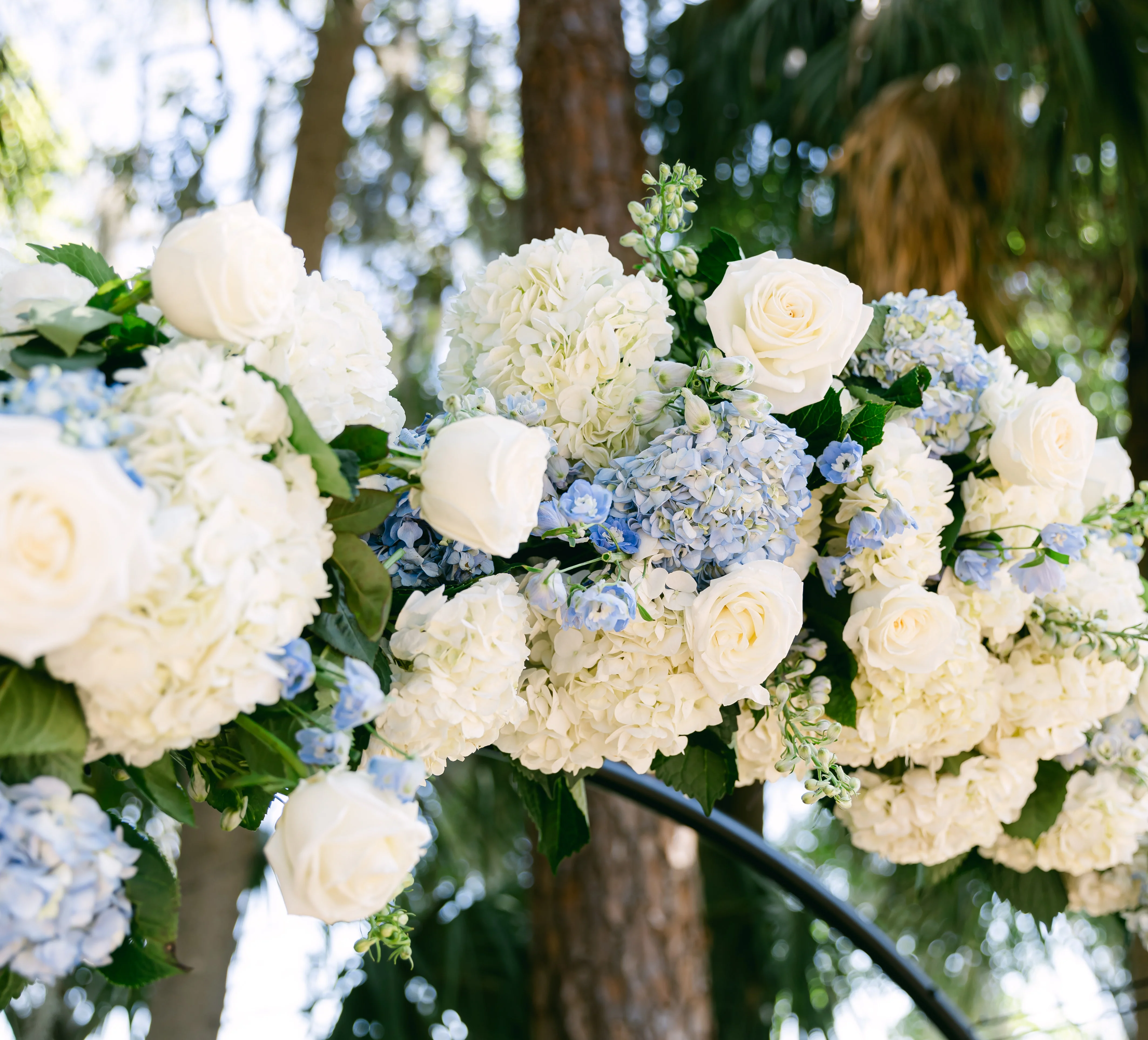 Elegant floral arrangement with white and blue flowers